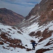Yassin descends the valley to Toubkal hut in soft and pleasant snow